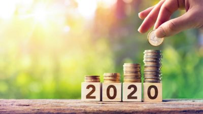 Growing stack of coins on top of wooden blocks spelling out '2020', future wealth, asx future