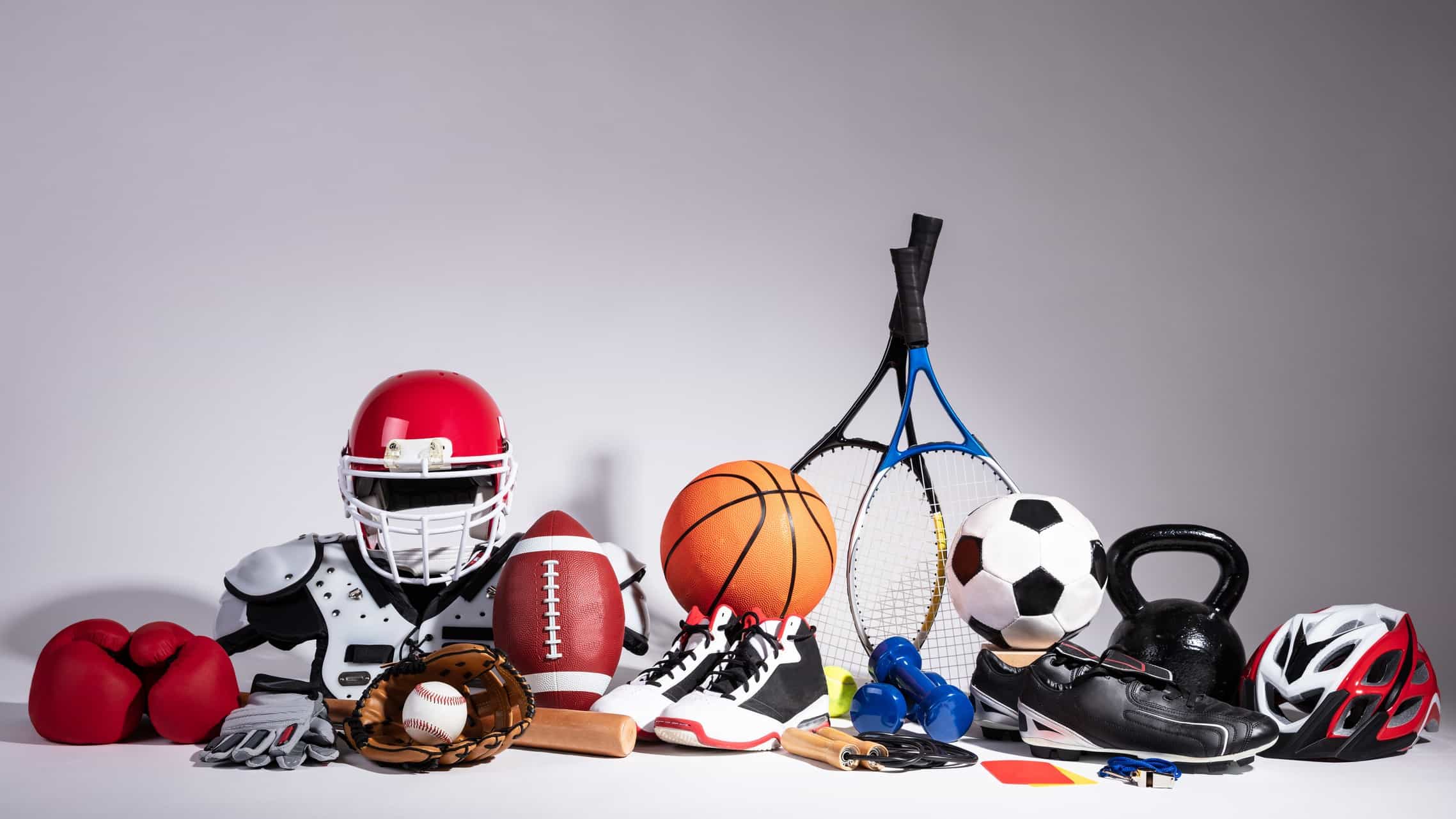 Pile of sporting equipment against a white background
