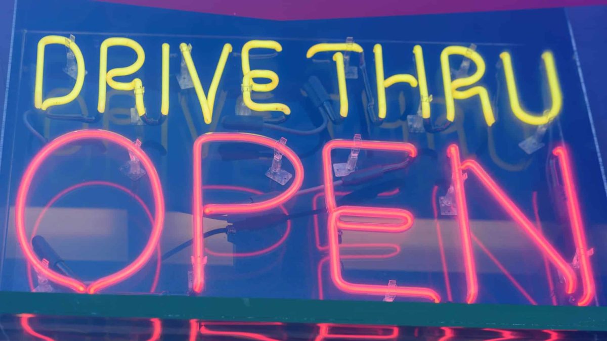 neon sign reading drive thru open