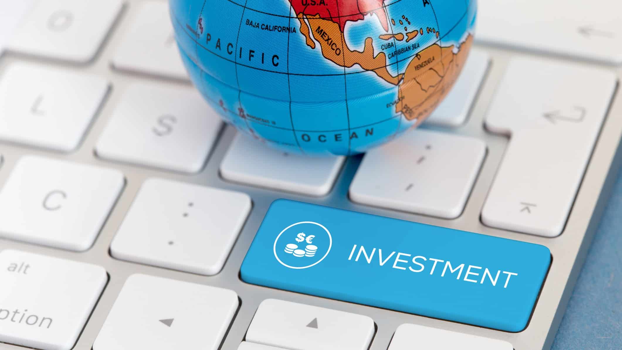 Globe on keyboard with investment key, international shares