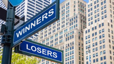 ASX shares buy Street signs stating 'Winners' and 'Losers' in front of urban backdrop