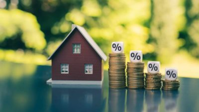 model house and reducing stacks of coins with percentages, house prices asx