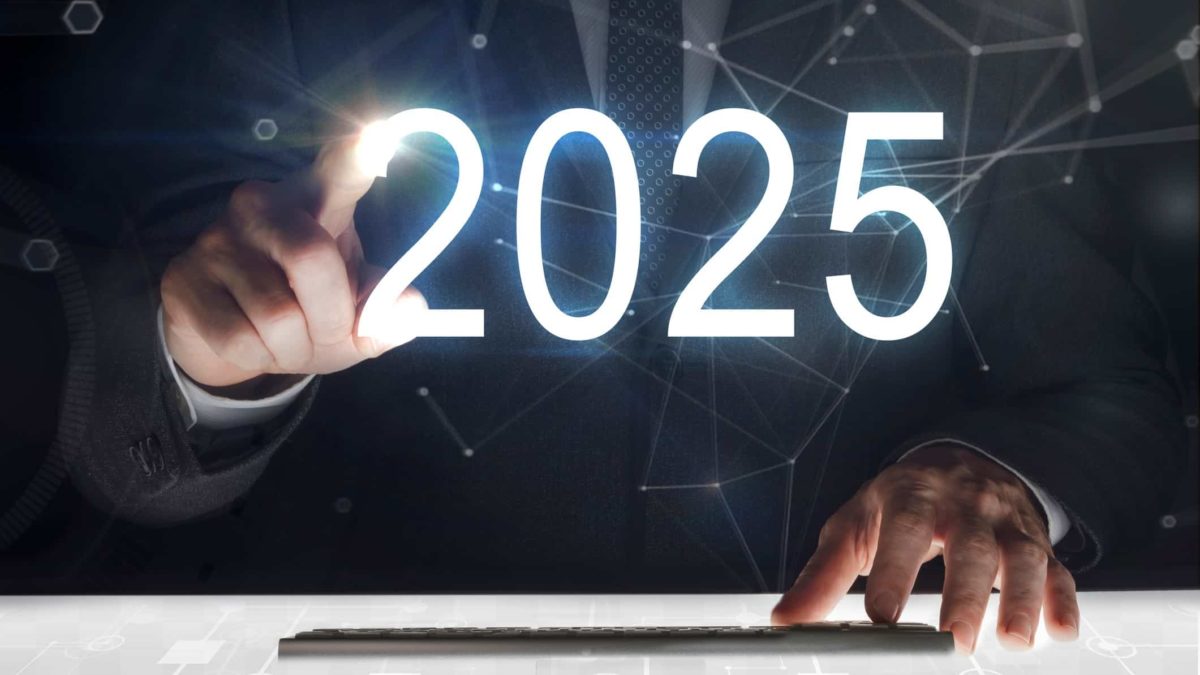 business man touching digits 2025 on digital screen
