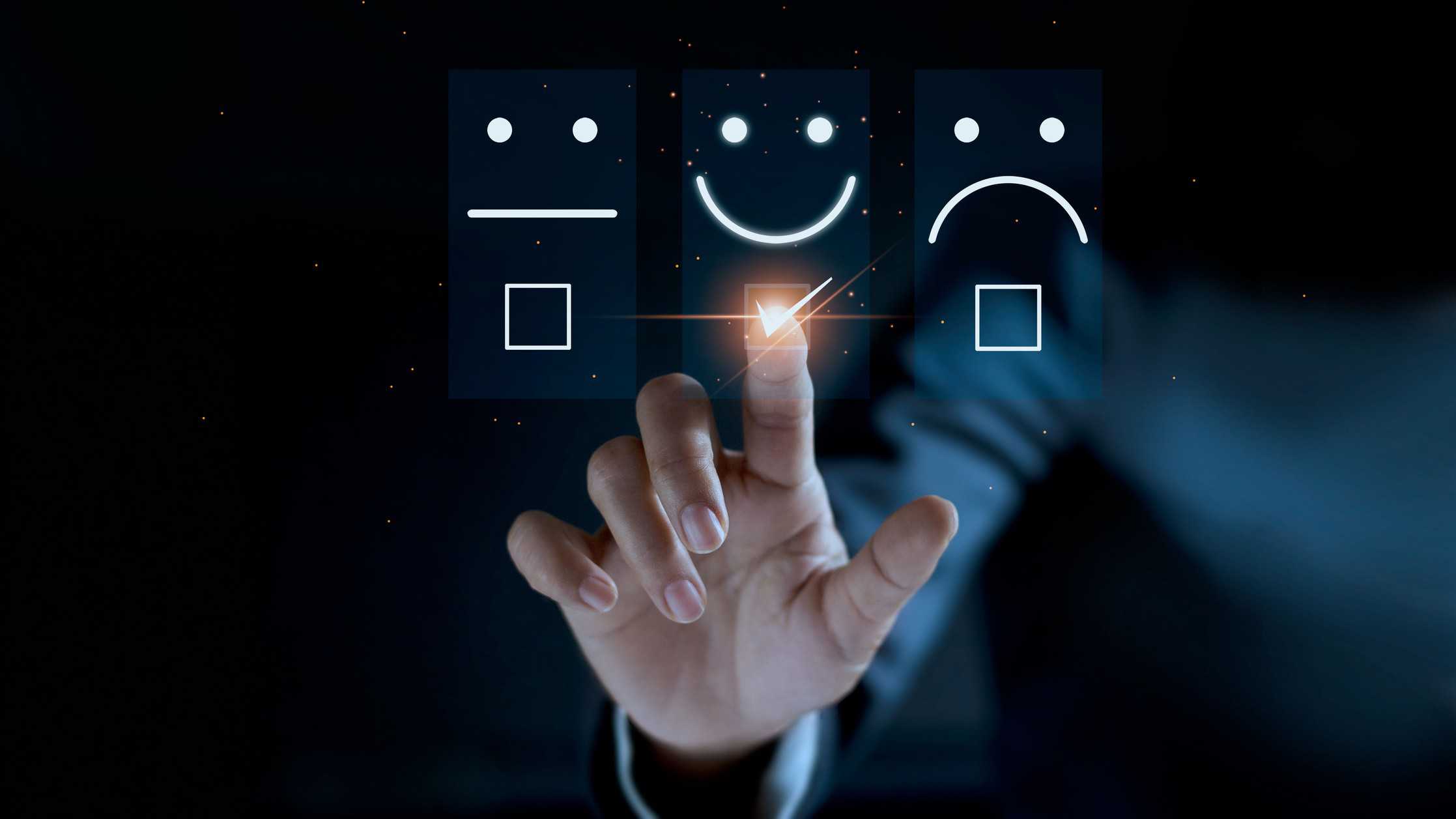 Investor touching a screen with a smiley face icon on it