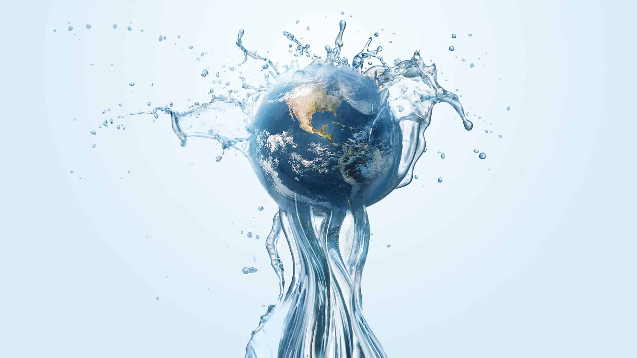 World globe being held up by stream of water representing liquidity