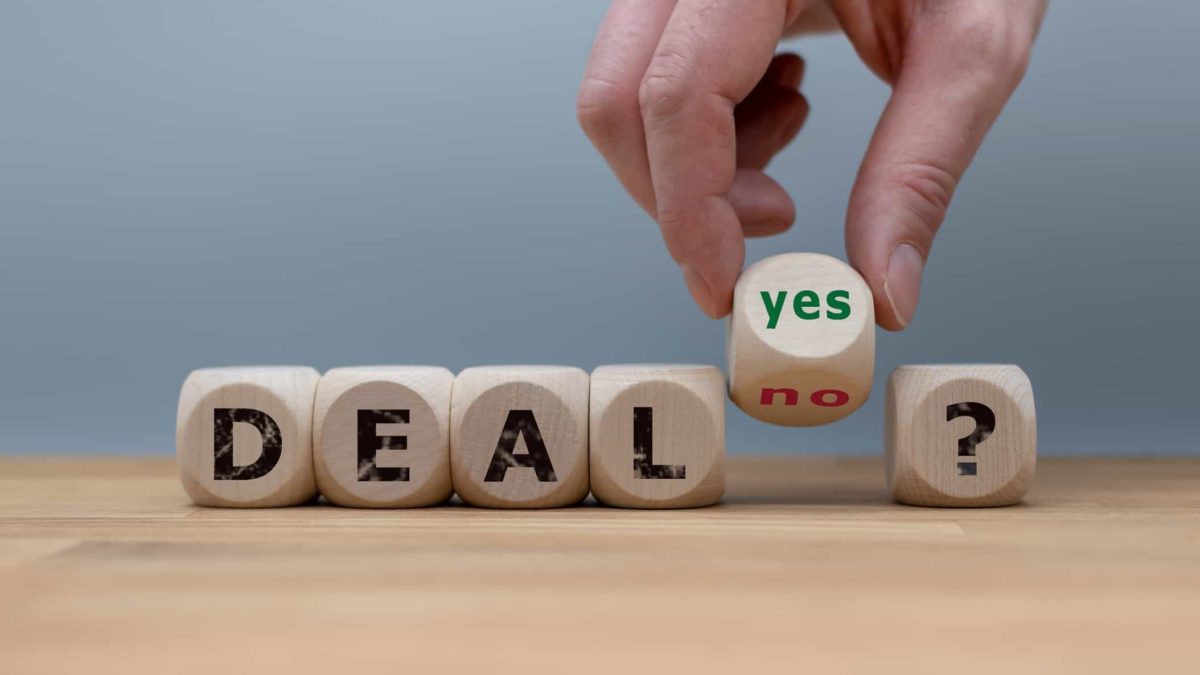 wooden blocks spelling deal with one block saying yes and no representing wesfarmers share price