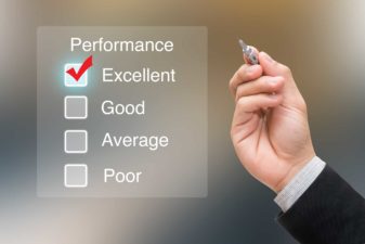 business man ticking excellent on digital performance chart