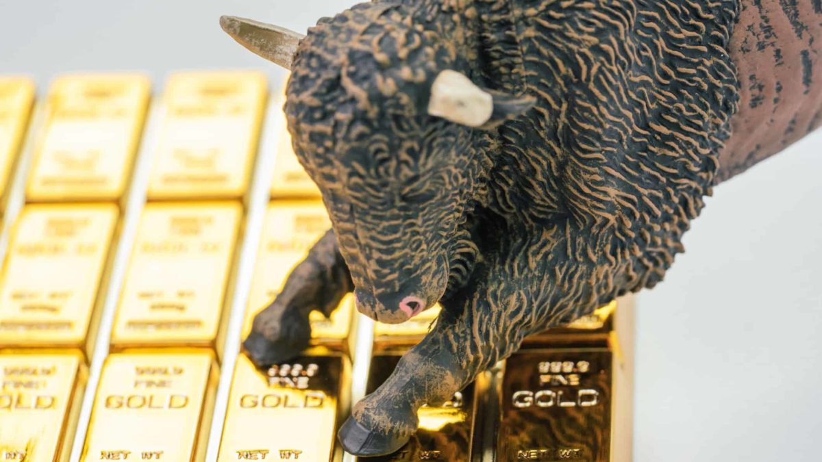 figurine of a bull standing on gold bars