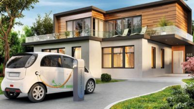 electric car charging at charging point in front of a modern home