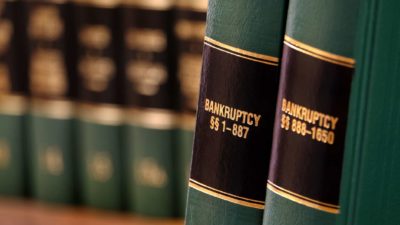 close up of books on bankruptcy representing bby collapse