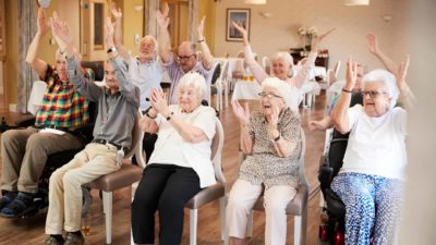 group of seniors happily clapping representing rising eureka share price