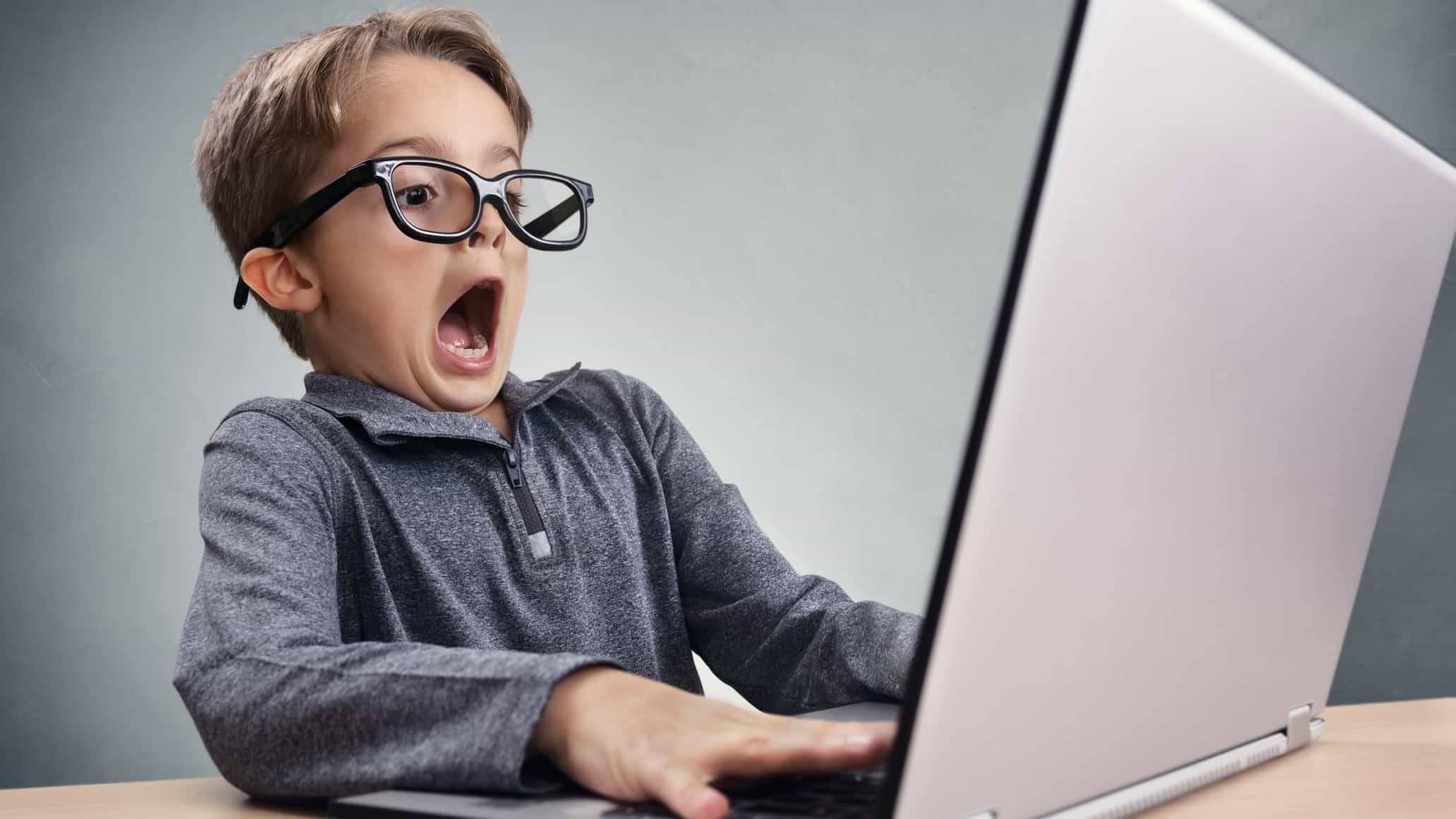 falling asx share price represented by child looking shocked at computer screen