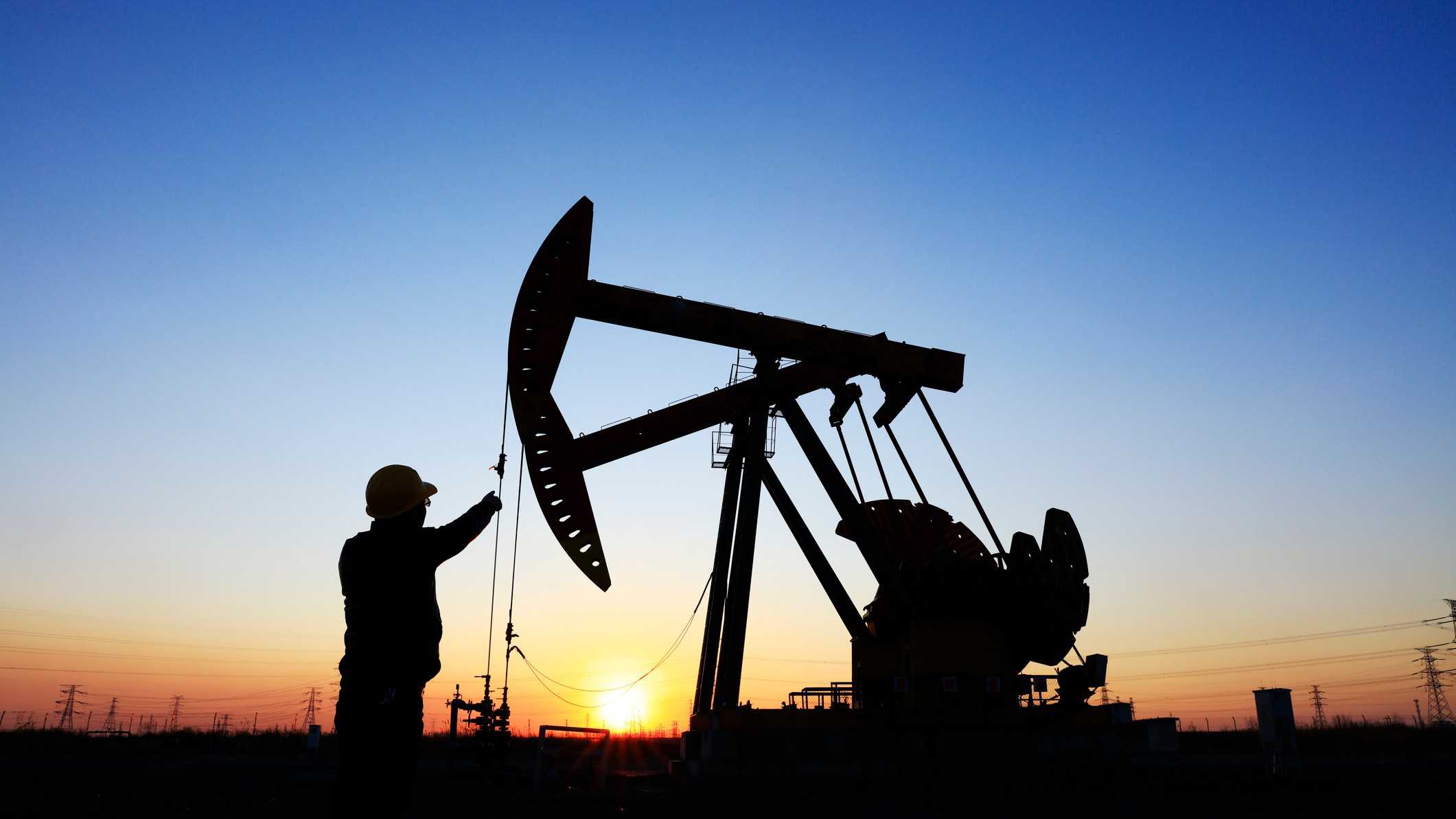 oil drill in sunset