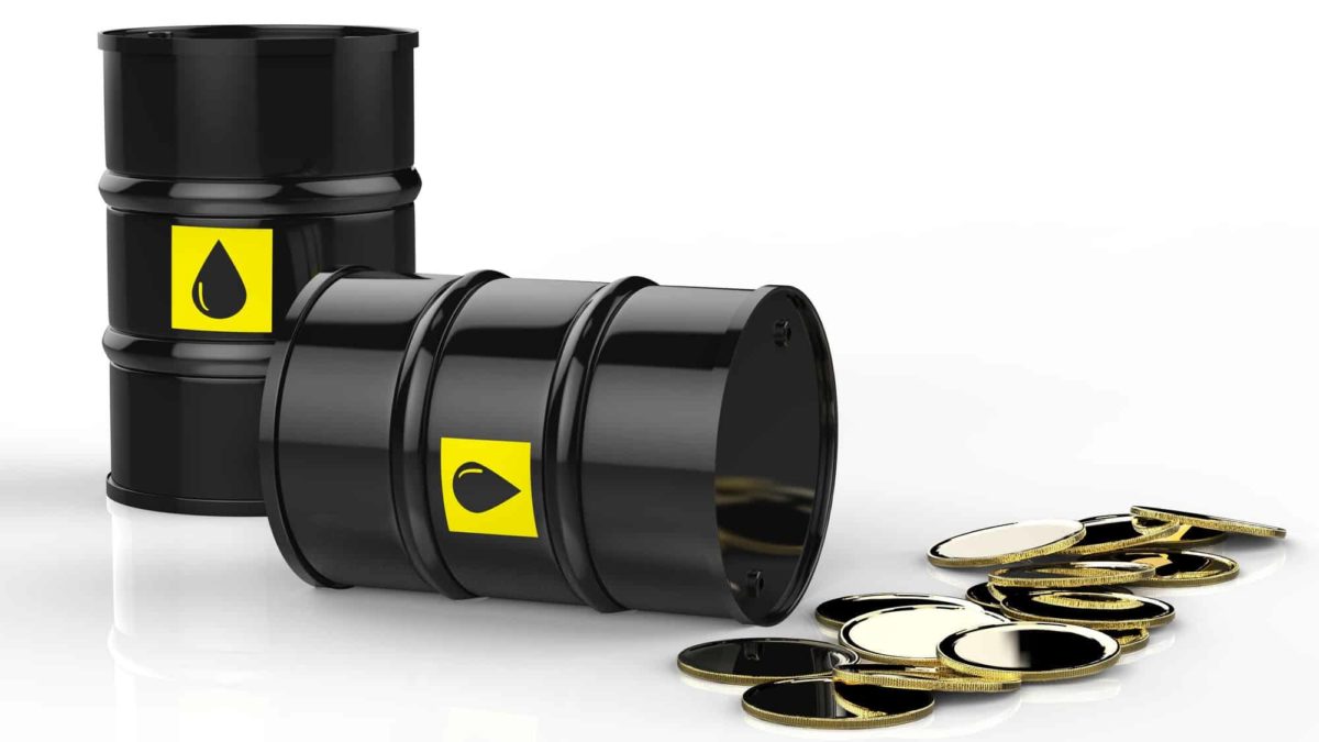 oil can falling over and spilling coins signifying fall in oil share prices