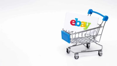 miniature shopping trolley containing ebay business card