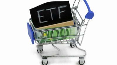miniature shopping trolley containing black board with the word ETFs on it