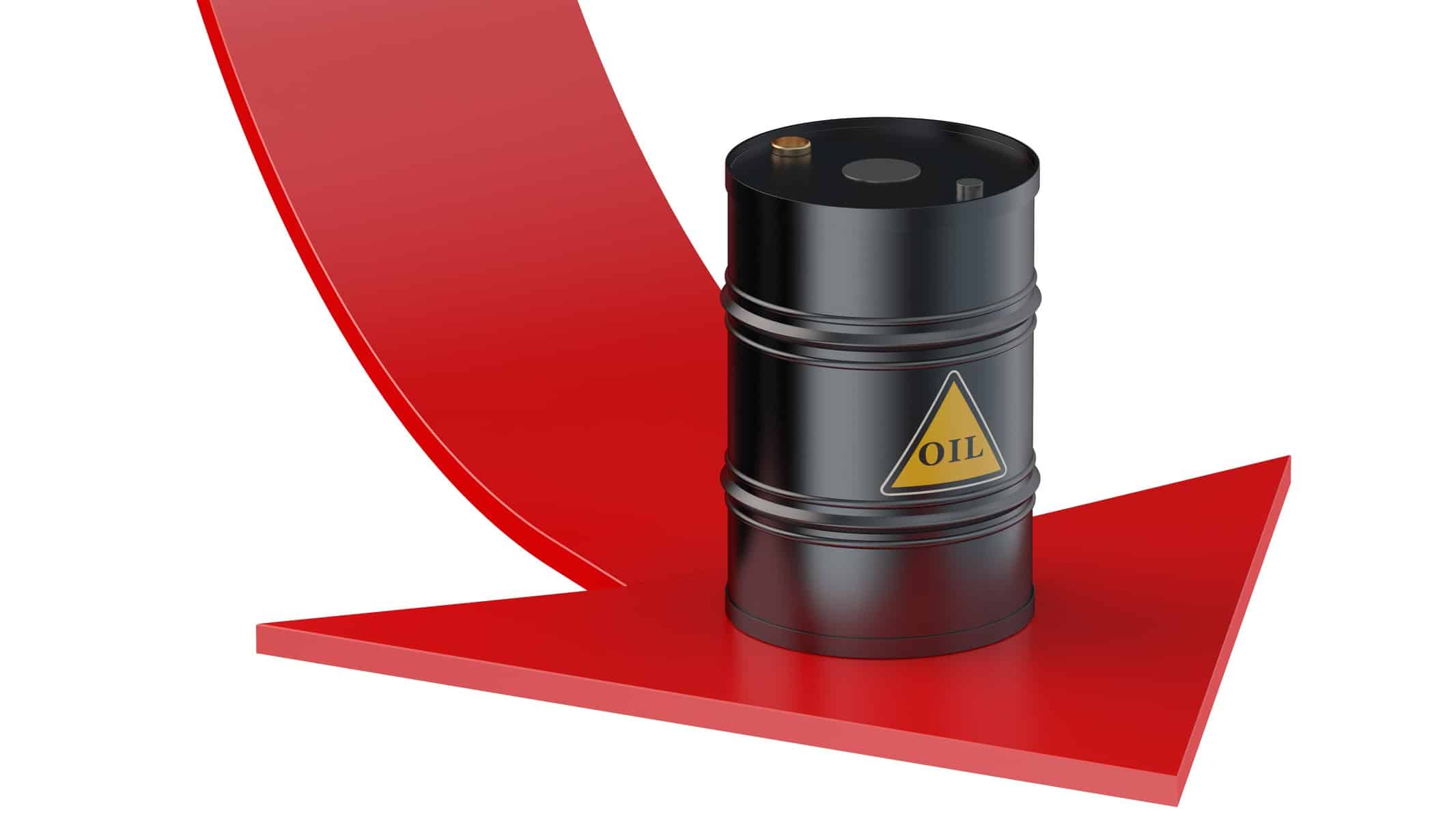 barrel of oil sitting on top of falling red arrow representing asx energy shares downgrade