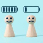 asx lithium shares represented by two little wooden peg dolls one with happy face below full battery icon, the other with sad face below empty battery icon