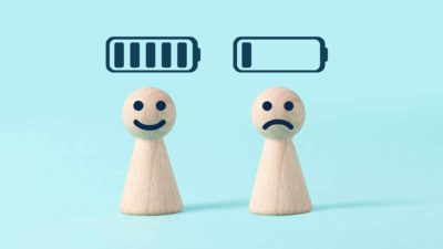 asx lithium shares represented by two little wooden peg dolls one with happy face below full battery icon, the other with sad face below empty battery icon