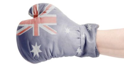 Upgrade of asx shares represented by boxing glove printed with australian flag
