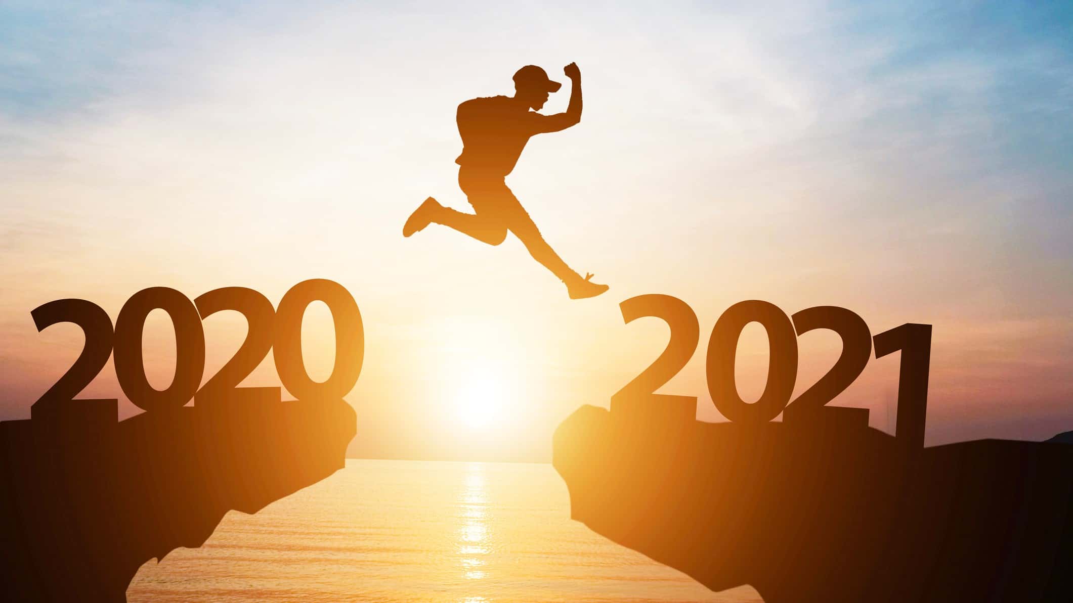 man jumping from 2020 cliff to 2021 cliff representing asx outlook 2021