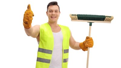 garbage man holding broom and giving thumbs up representing rising cleanaway share price