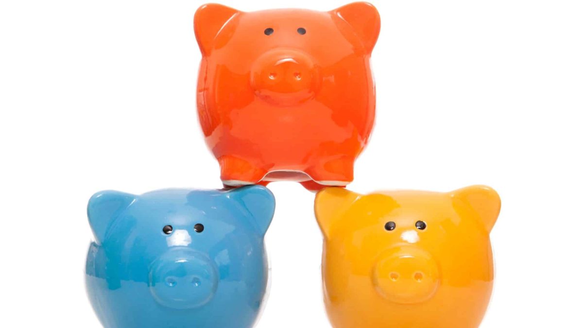 3 colourful piggy banks stacked up representing asx growth shares