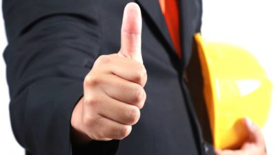 man holding hard hat and giving thumbs up representing rising mining asx share price