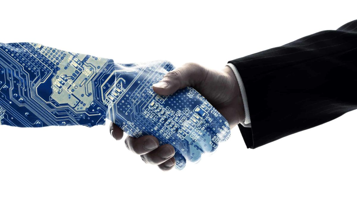 two harms shaking hands with one arm appearing as a circuit board representing senetas share price