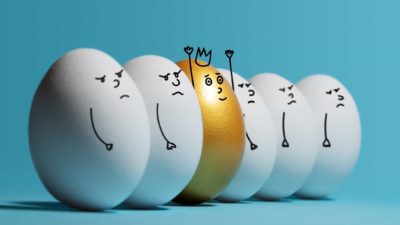 outperforming asx share price represented by row of white eggs with cartoon sad faces with one gold egg with happy face and crown