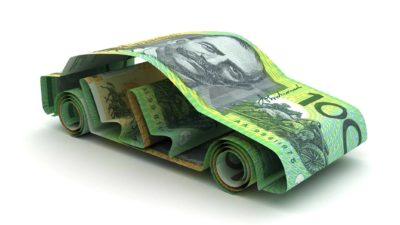 australian one hundred dollar notes formed in the shape of a car representing tesla shares