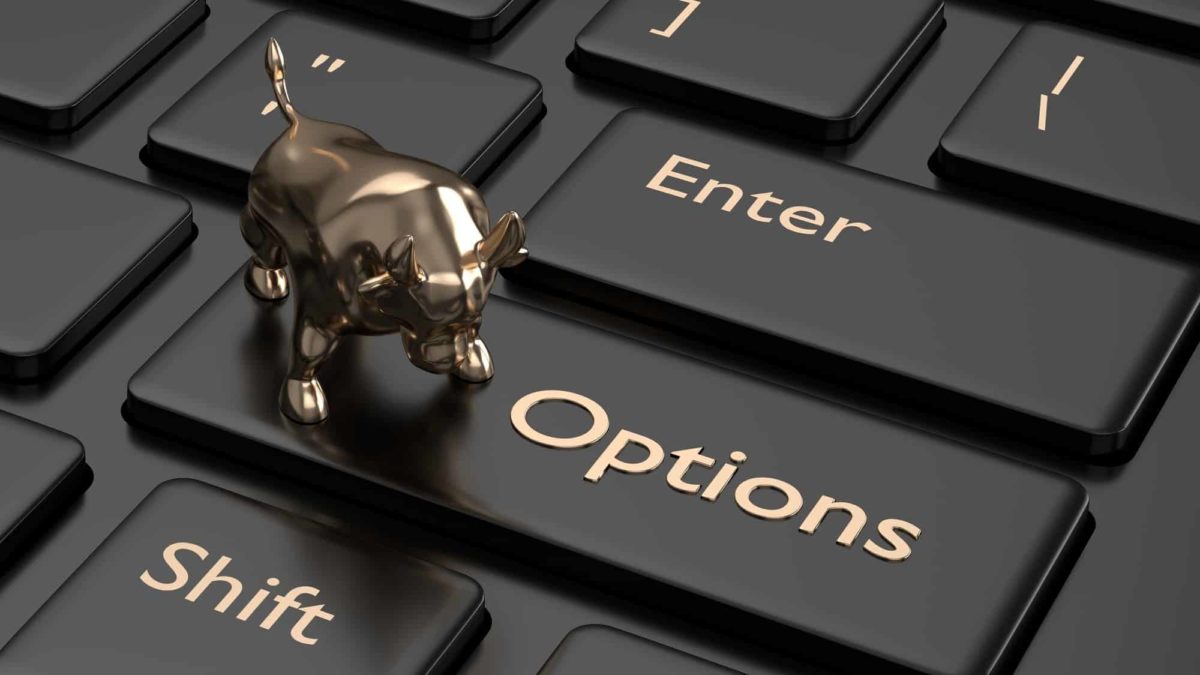 Black keyboard with small gold bull figurine on top of button with 'Options' written on it