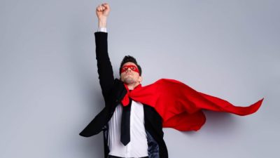 ASX shares buy unstoppable asx share price represented by man in superman cape pointing skyward