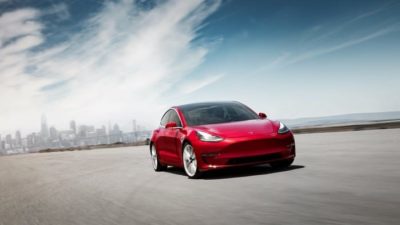 Red Tesla electric car