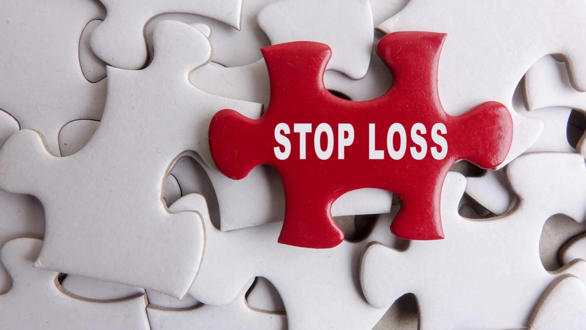 asx shares stop loss represented by white jigsaw pieces with red jigsaw piece on top that says 'stop loss'
