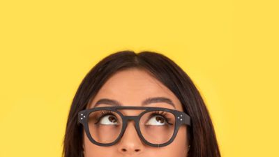 woman looking up as if watching asx share price