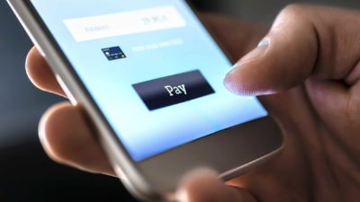 Afterpay share price SquarePaypal credit card ASX shares Afterpay share price asx buy now pay later shares such as zip and afterpay share price represented by finger pressing pay button on mobile phone