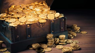 Old chest filled with gold coins