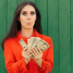 A greedy woman gloats over a cash incentive.