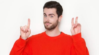 three reasons to buy asx shares represented by man in red jumper holding up three fingers