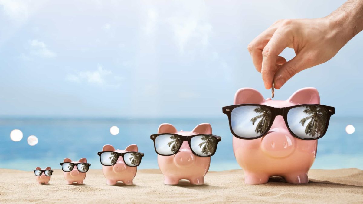 using asx shares to retire represented by piggy bank on sunny beach