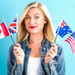 comparing asx 200 to global indexes represented by woman holding up multiple countries' flags