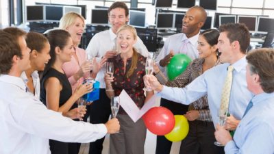 group of asx 200 investors celebrating increasing share price