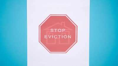 ban on home sale foreclosure represented by stop sign that says stop eviction