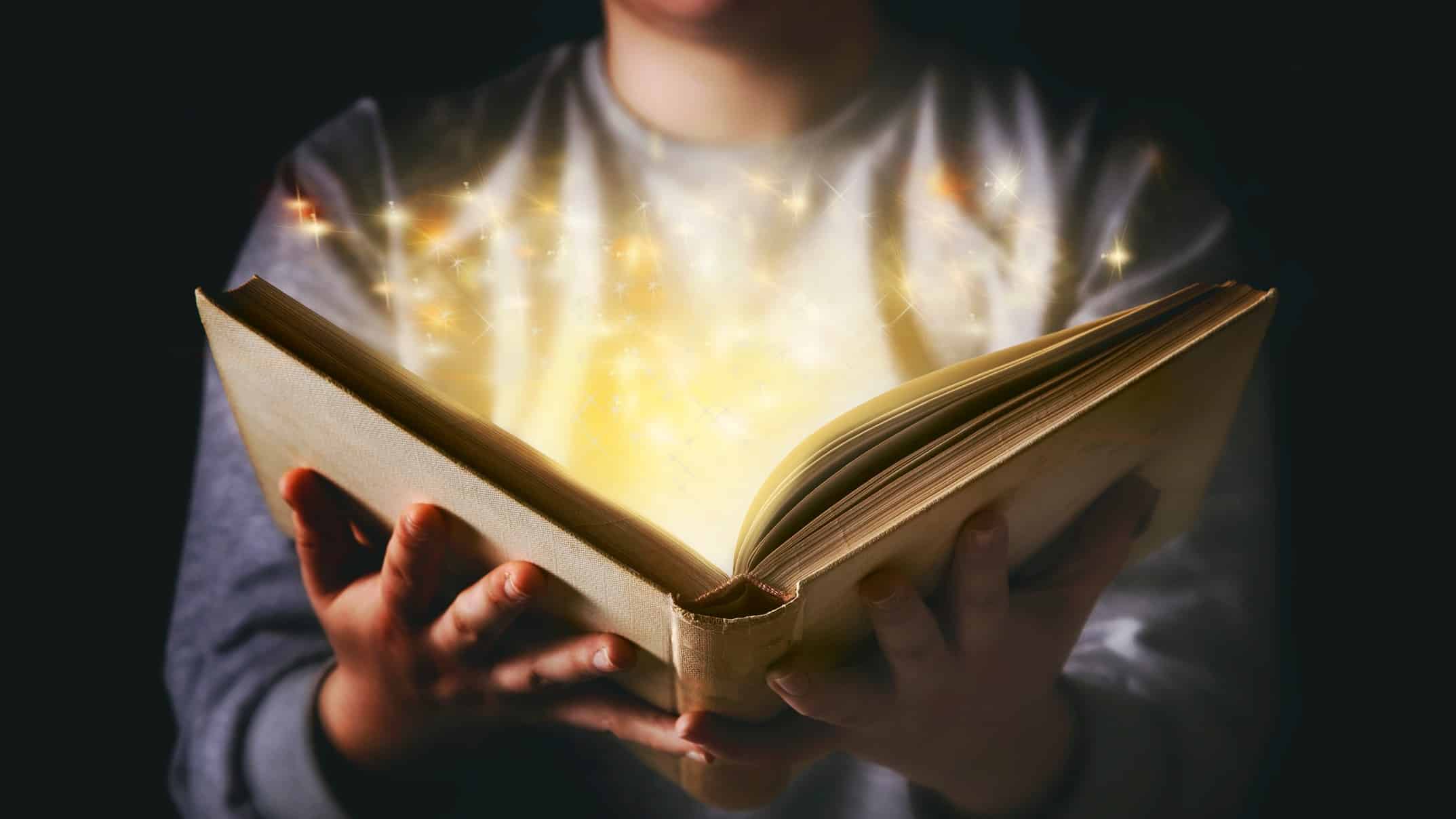 learning from the history of investment represented by old book opening with gold starts flowing from it