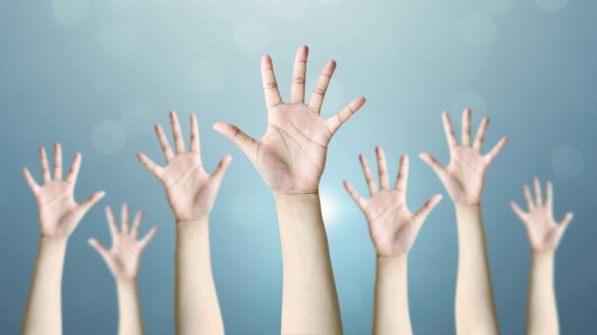 asx share price vote represented by lots of hands up in the air