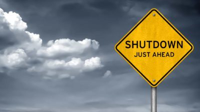 shutdown relating to asx shares and etfs represented by road sign stating shutdown ahead