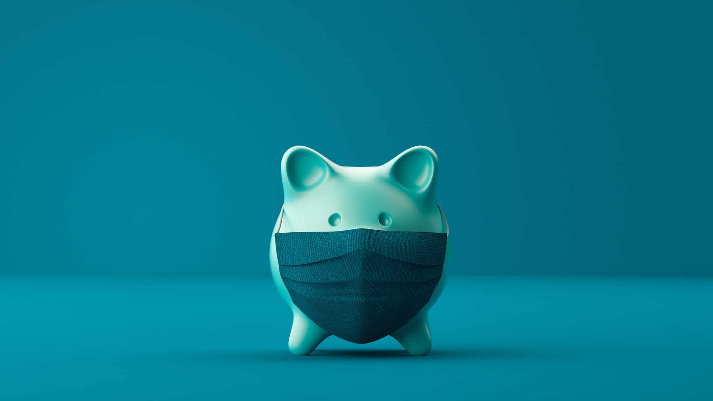 Green piggy bank with covid mask on