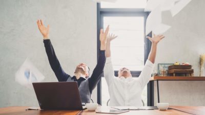 new asx share price IPO represented by 2 men throwing papers in the air gleeefully