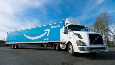 Amazon stock represented by Amazone prime truck driving along